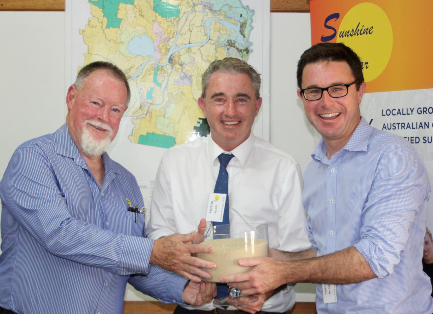 Photo L to R: Chris Connors, CEO of Sunshine Sugar; Kevin Hogan, Member for Page, holding a bowl of locally produced Low GI sugar; David Littleproud, Minister for Agriculture.